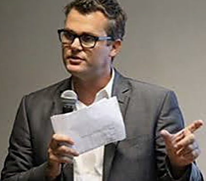 William Skelley presenting from notes at a founder event